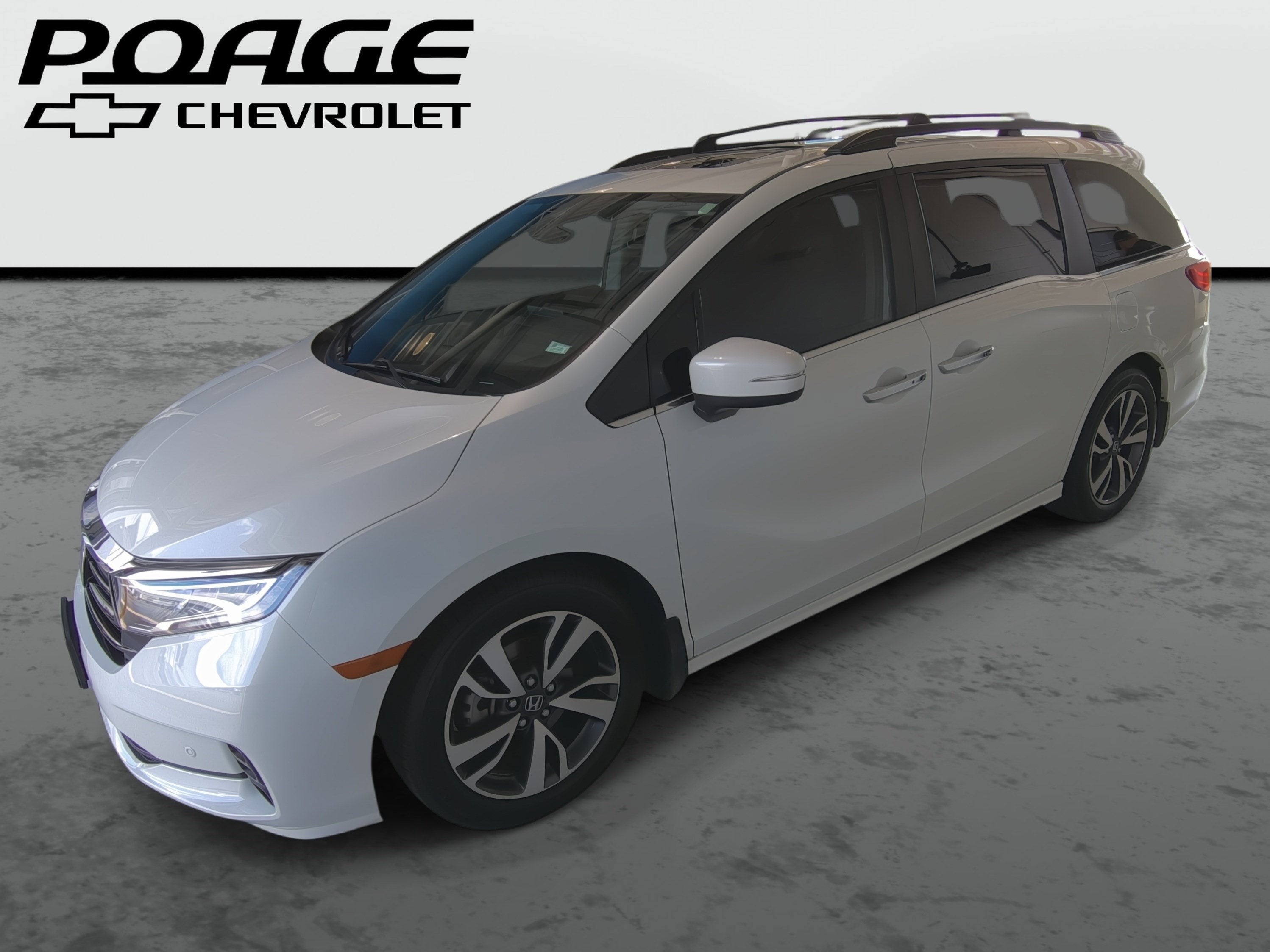 2023 Honda Odyssey Touring in White — front three-quarter view